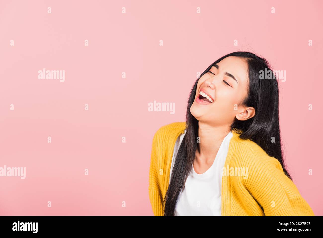 woman standing winning and surprised excited screaming laughing Stock Photo