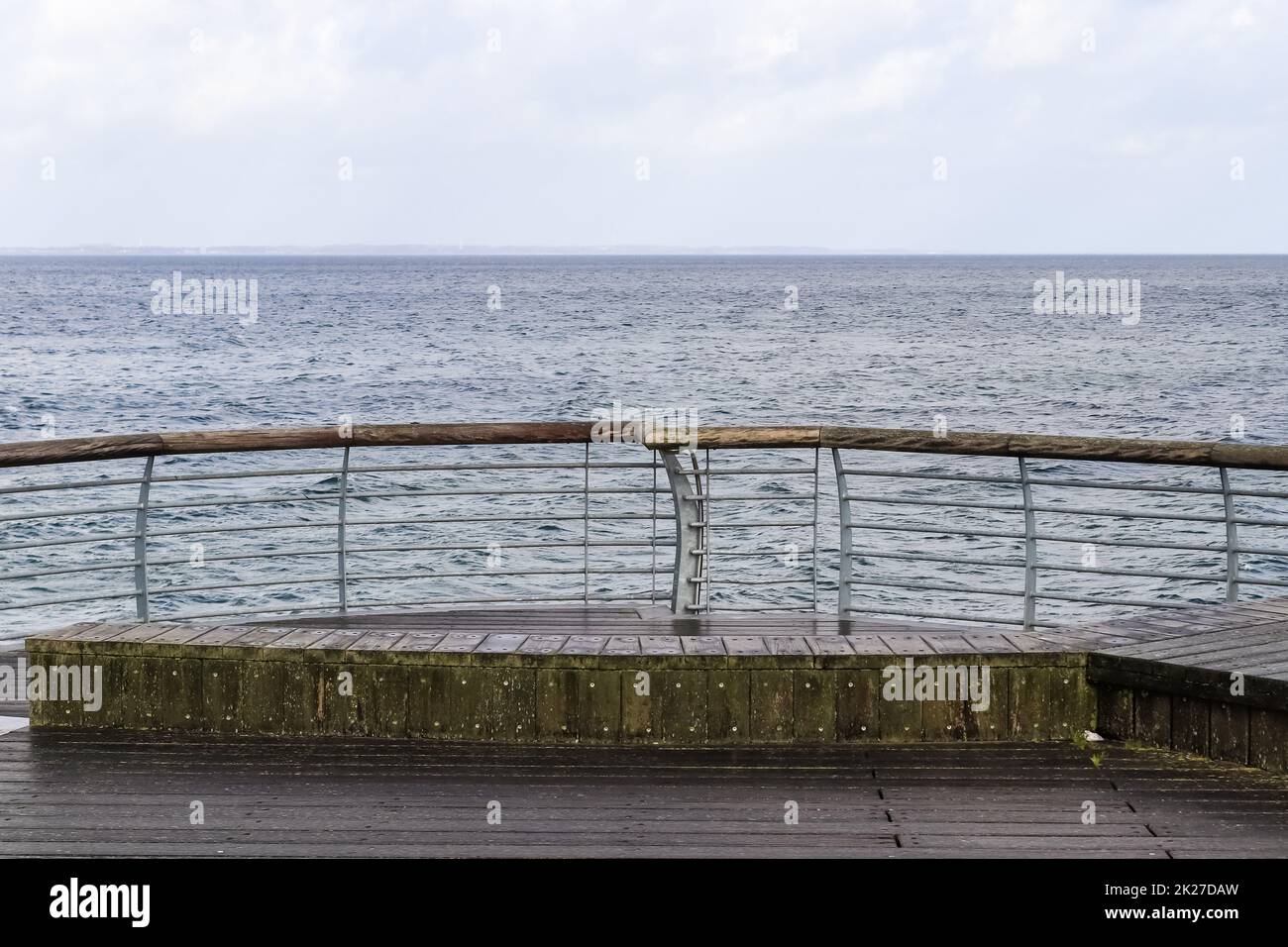 Niendorf, Germany - 30.January 2022: View of the stormy Baltic Sea at a pier in Niendorf on Timmendorfer Strand. Stock Photo