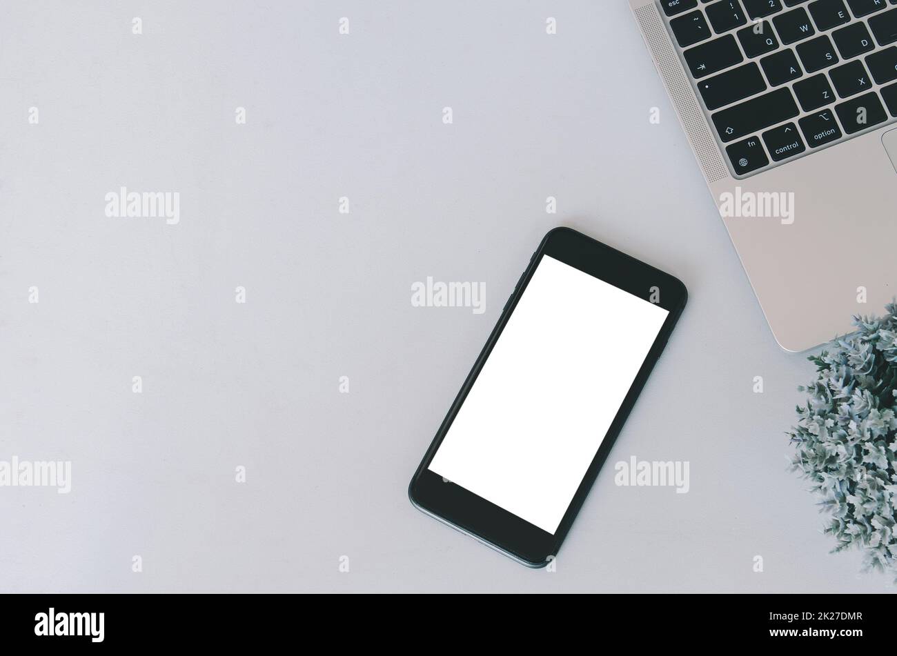 Mockup a mobile phone and computer laptop. Blank screen with text or image for an advertisement. Stock Photo