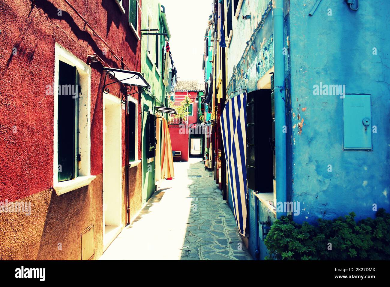 Street with colorful buildings in Burano island, Venice, Italy. Stock Photo