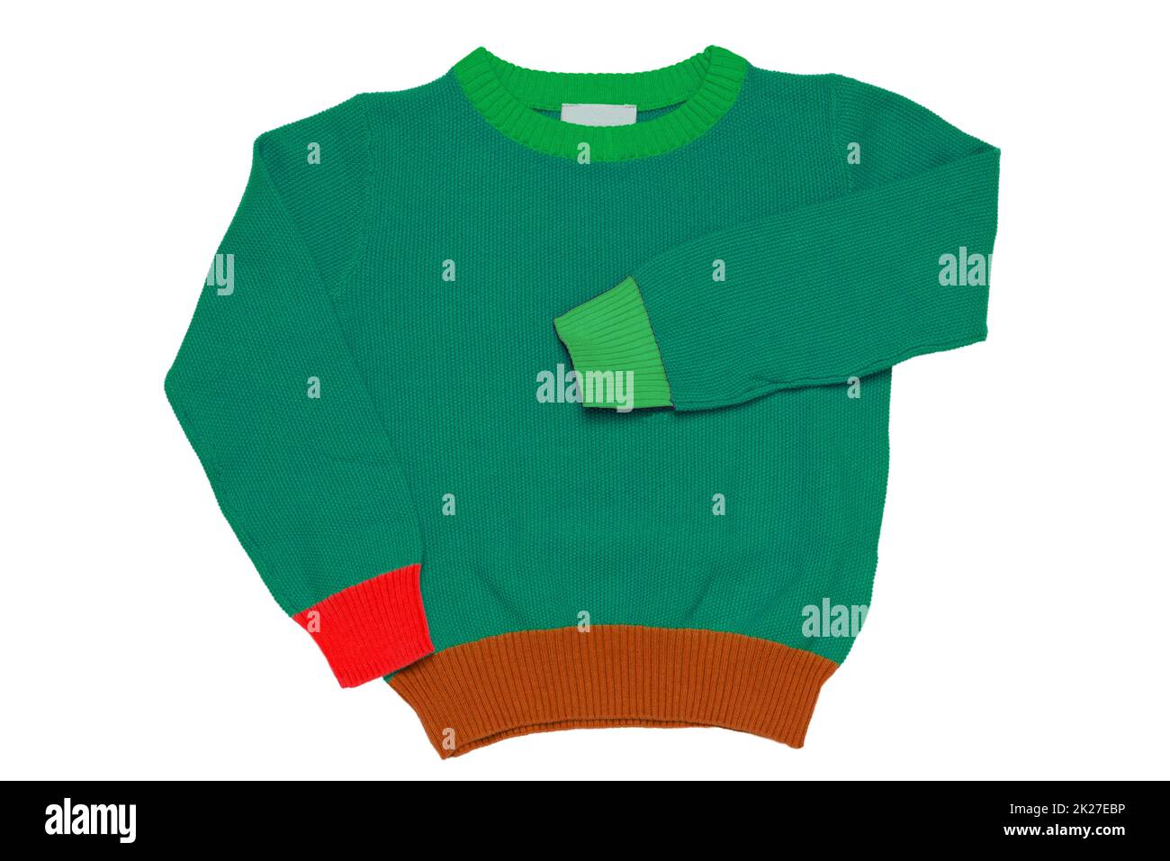 Top view of clothes for child boy isolated on a white background. A beautiful green little child sweater or knitted cardigan. Autumn and winter fashion for kids. Stock Photo