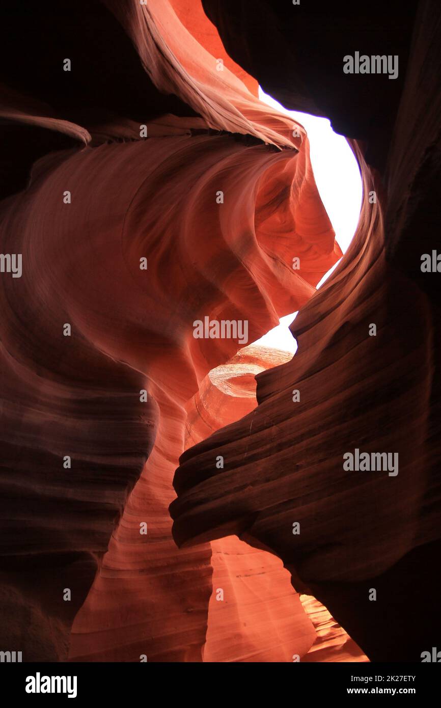 The contrast between the shadows and the lights inside the narrow red Antelope Canyon Stock Photo