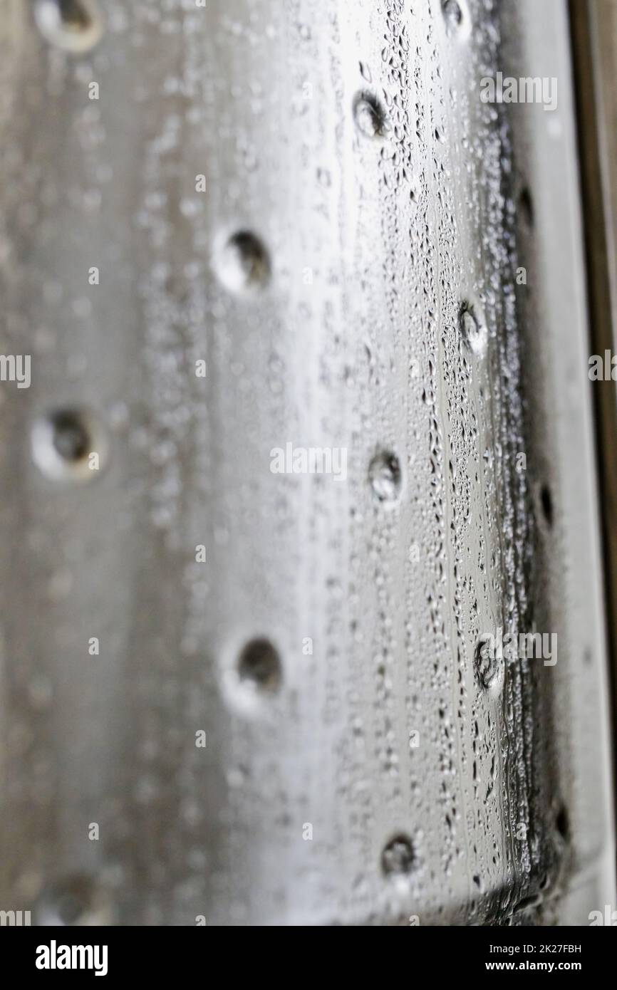 Now thats cold. Closeup shot of water condensation on a metallic cylinder. Stock Photo