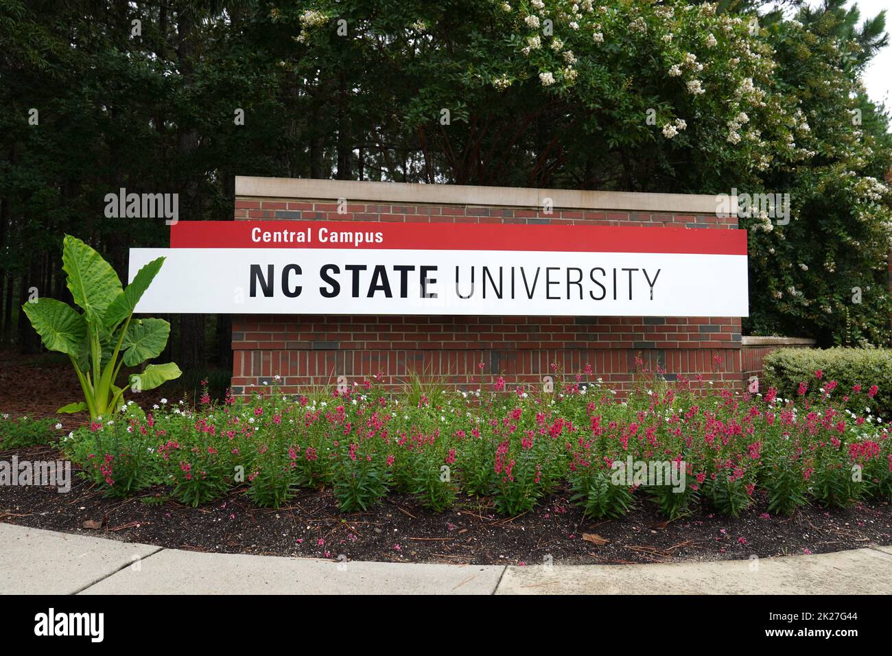 North Carolina State University sign surrounded by a flowerbed Stock Photo