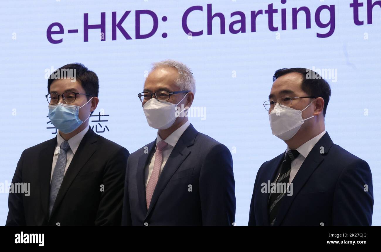 (L to R) Hong Kong Monetary AuthorityHH Economic Research Head Michael Cheng Kim-sum, Deputy Chief Executive Howard Lee, and Financial Infrastructure Executive Director Colin Pou Hak-wan, at the HKMA offices in Central, briefing the press over  the test of digital coin e-HKD from the fourth quarter. 20SEP22 SCMP / Jonathan Wong Stock Photo