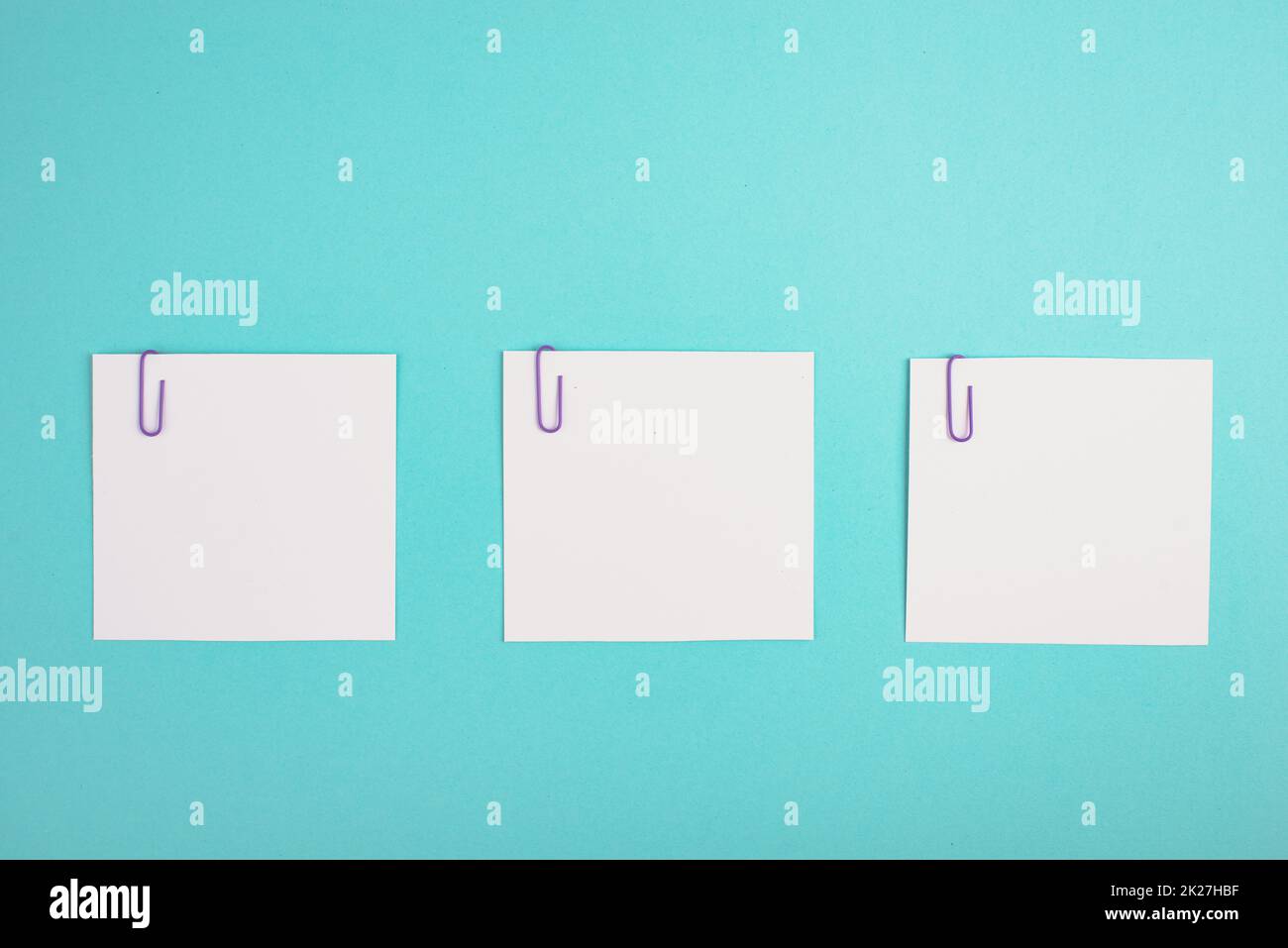Empty white paper pinned on a blue colored background, bulletin note, rreminder, empty copy space Stock Photo