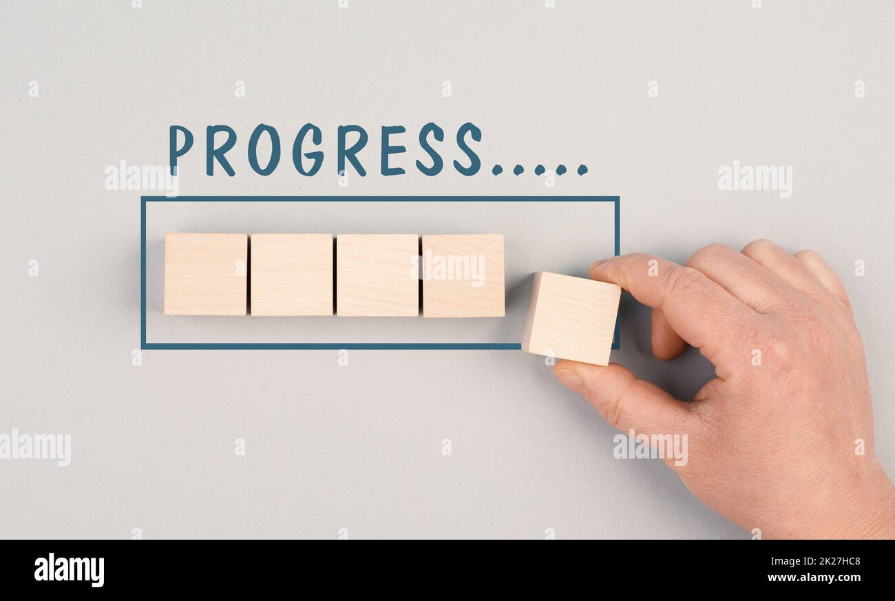 The words progress is standing over the loading bar, hand puts last ...