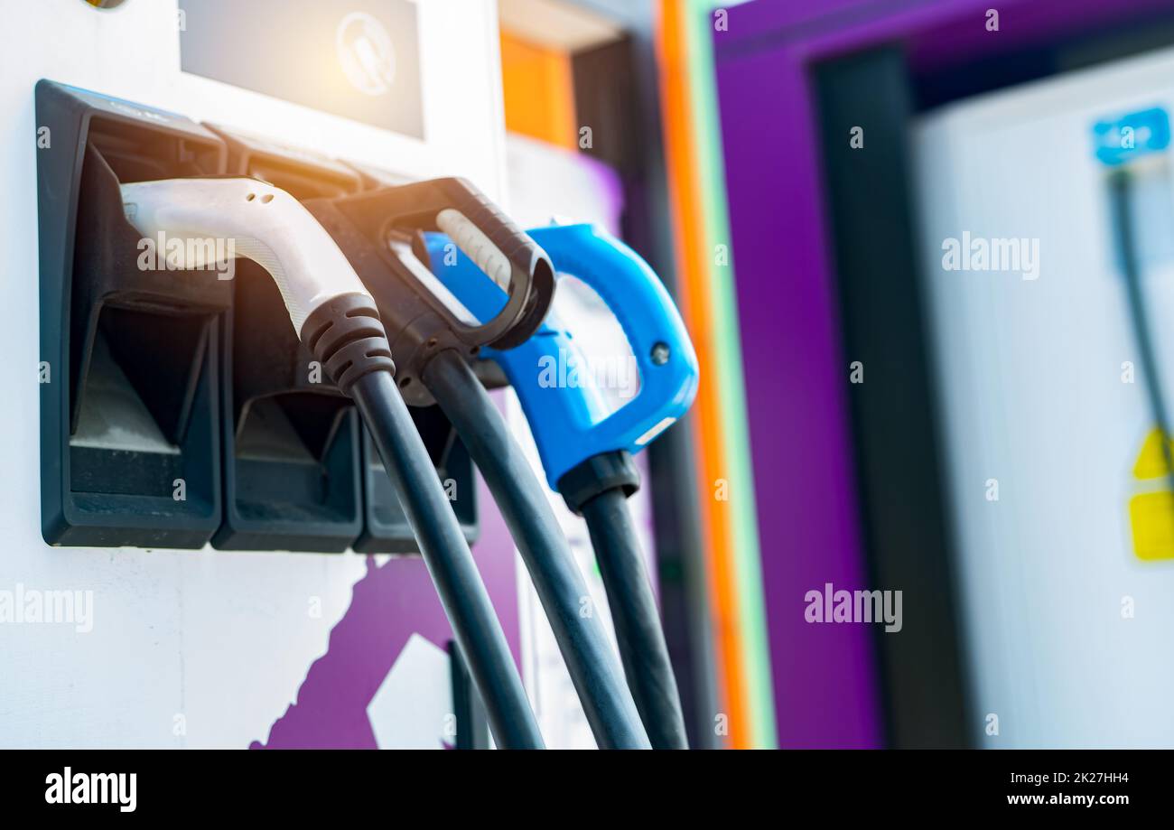 Electric vehicle charging station. Electric car charging station for charge EV battery. EV charger point. Sustainable energy. Alternative energy for smart city. EV charging point business concept. Stock Photo