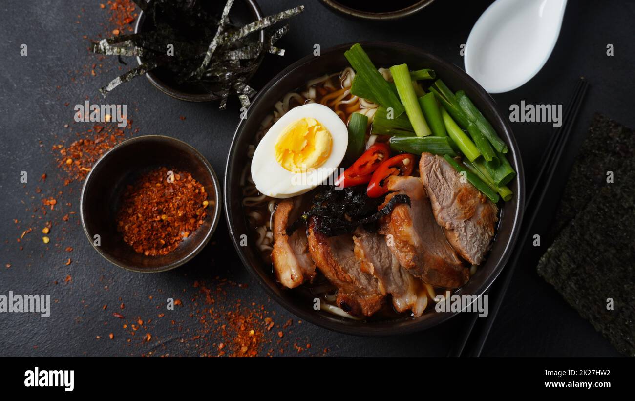 Ramen soup with hard boiled egg, vegetables, pork, soy sauce. Japanese