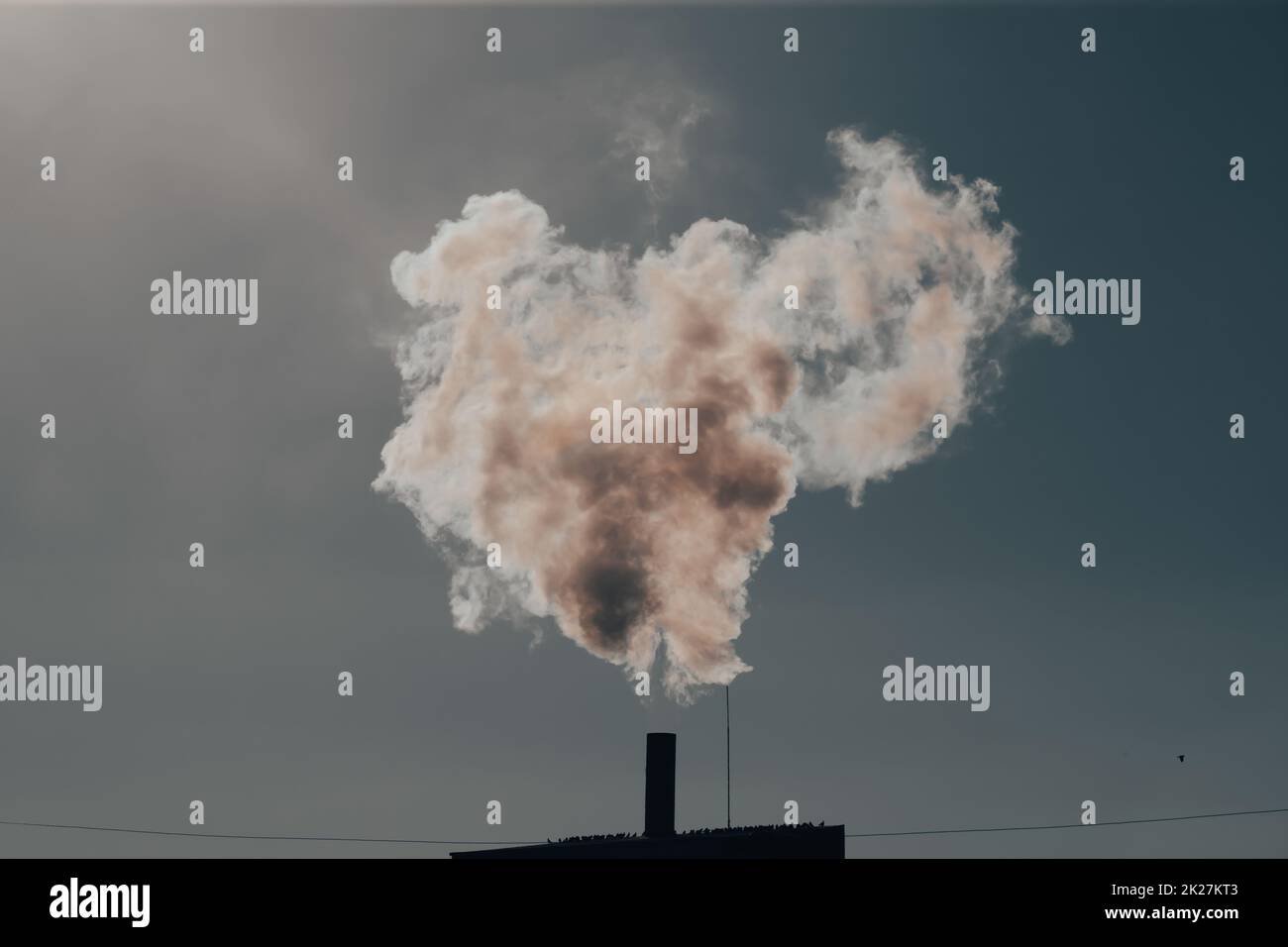 Smoke coming out of factory chimney Stock Photo Alamy