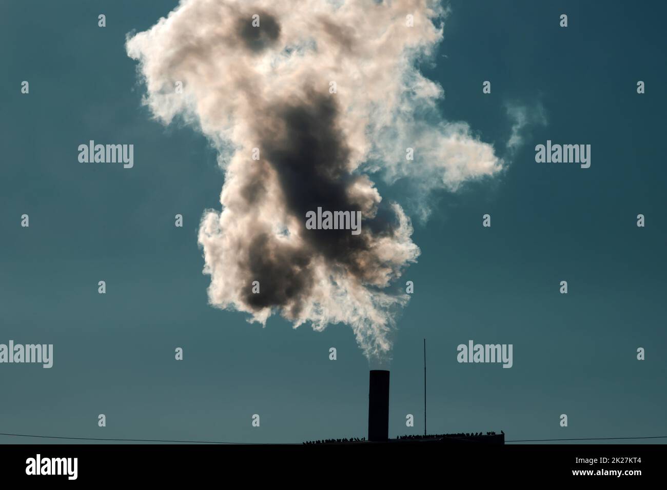 Smoke coming out of factory chimney Stock Photo Alamy