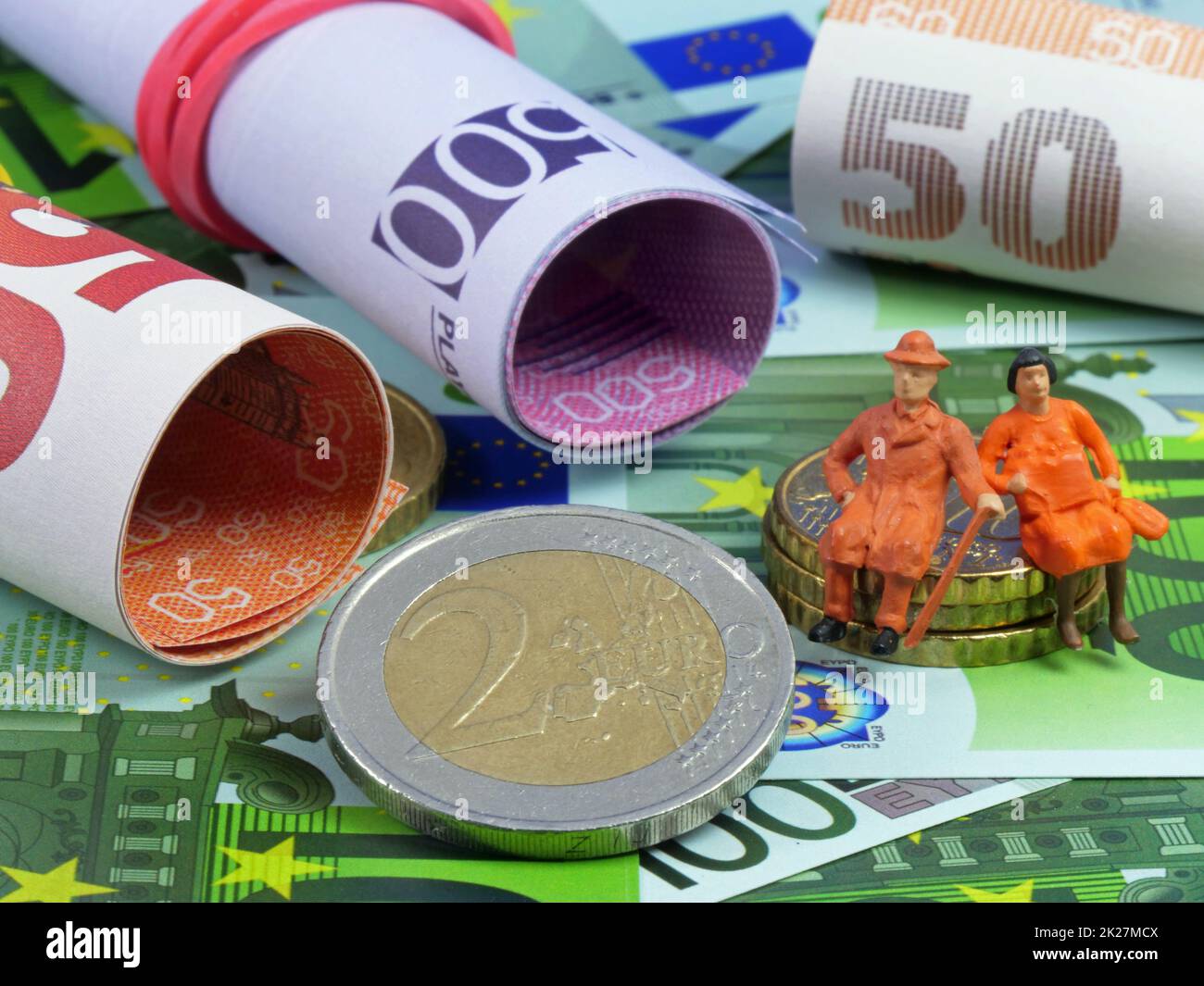 Pension as a symbolic image with euro banknotes and coins Stock Photo