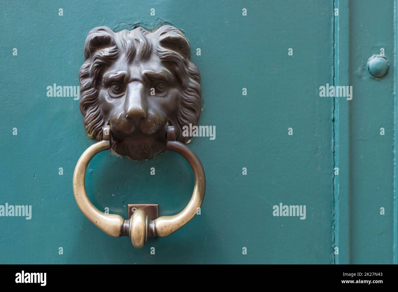 Antique iron and brass door knocker Stock Photo - Alamy