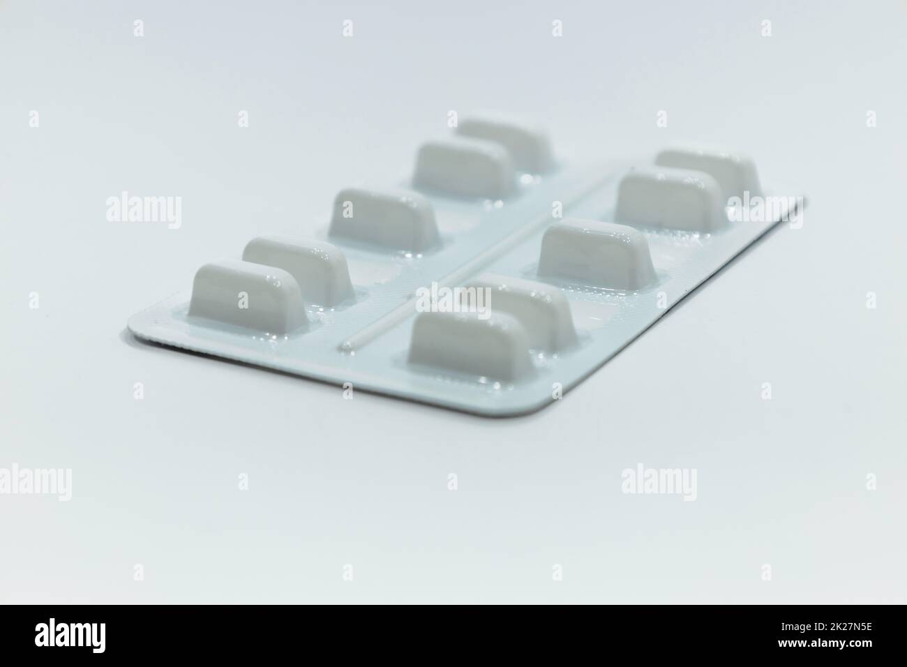 Medications pills in the blister pack on white background Stock Photo