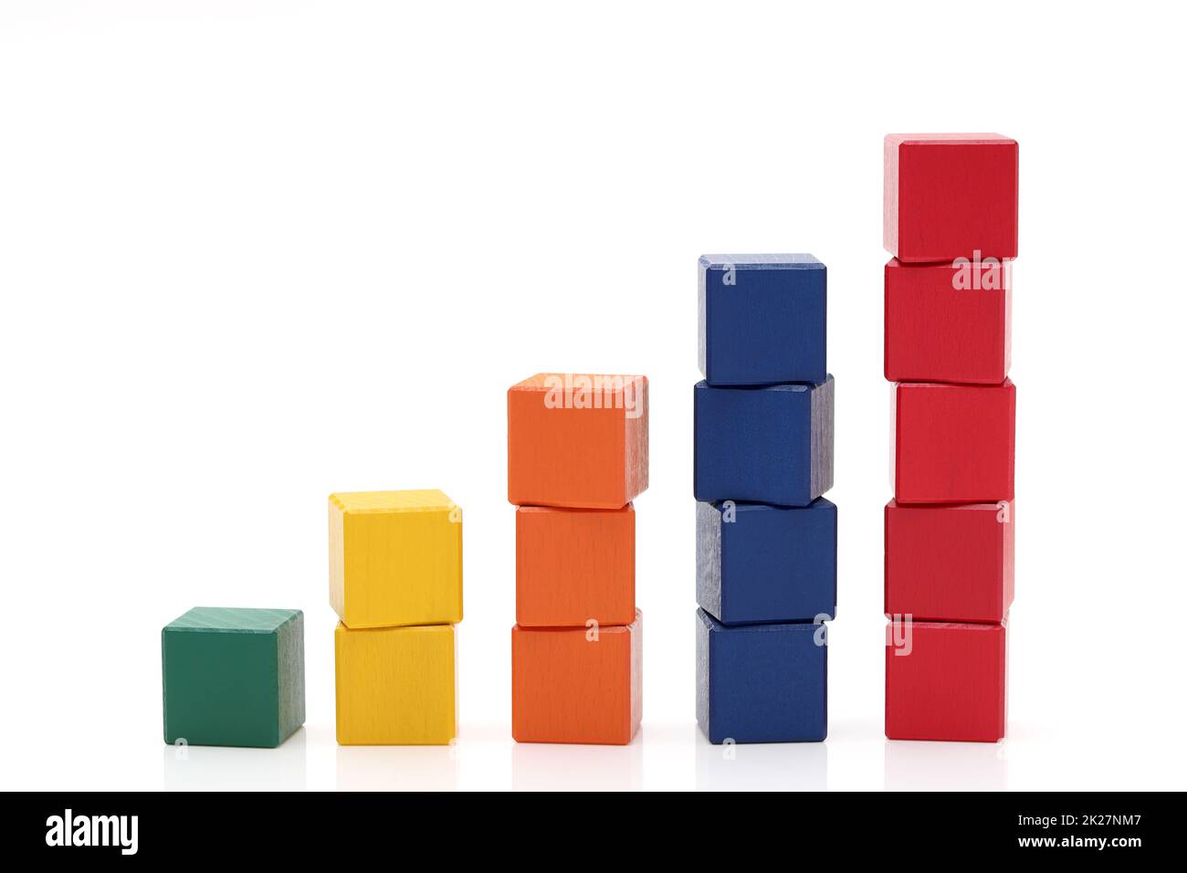 Stack of colorful wooden building blocks on white background Stock Photo