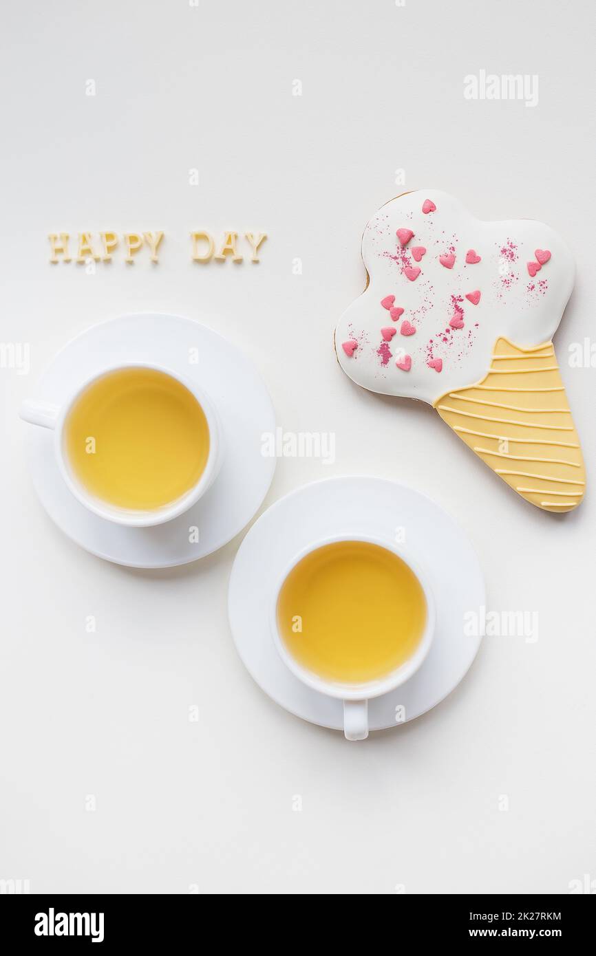 two cups of coffee on a table with cookies Stock Photo