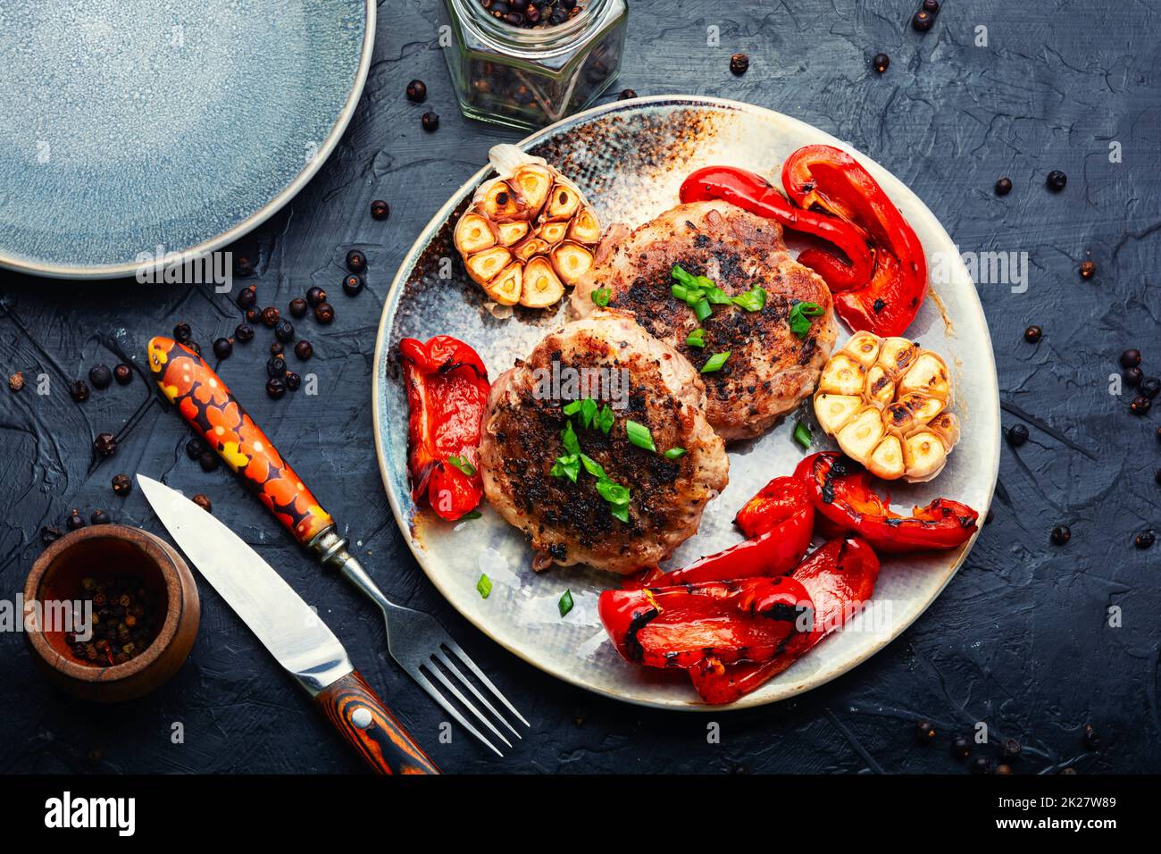 Fried beefsteak in bacon Stock Photo