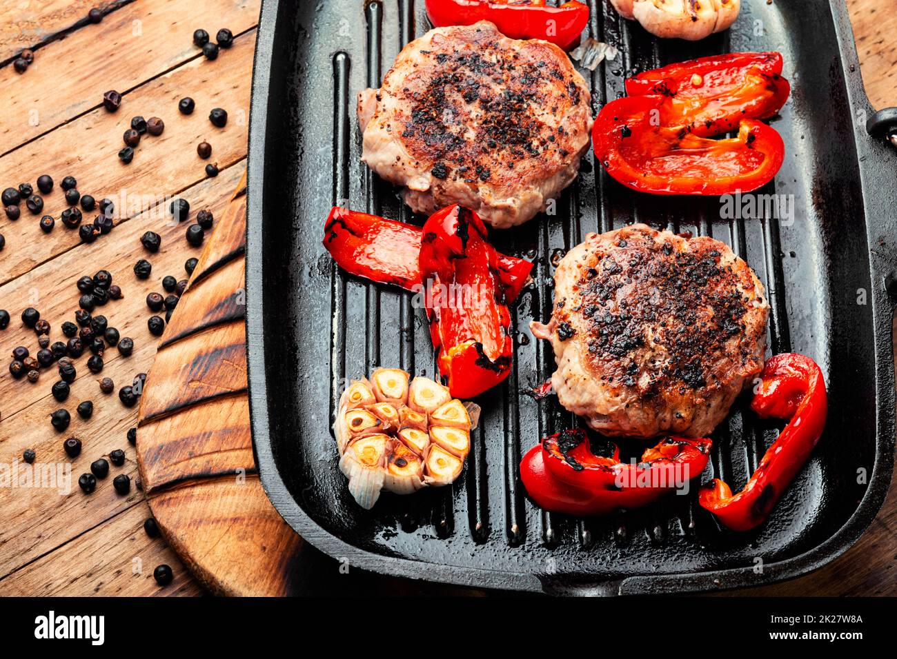 Fried beefsteak in bacon Stock Photo