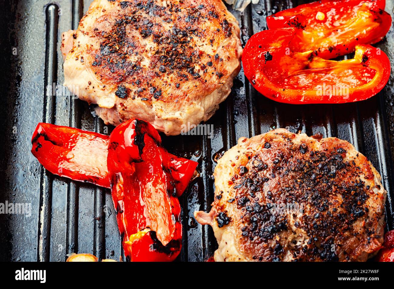 Fried beefsteak in bacon Stock Photo