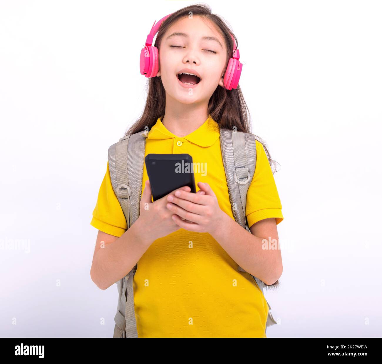 Happy student girl Listening music with headphones and sing song Stock Photo Alamy