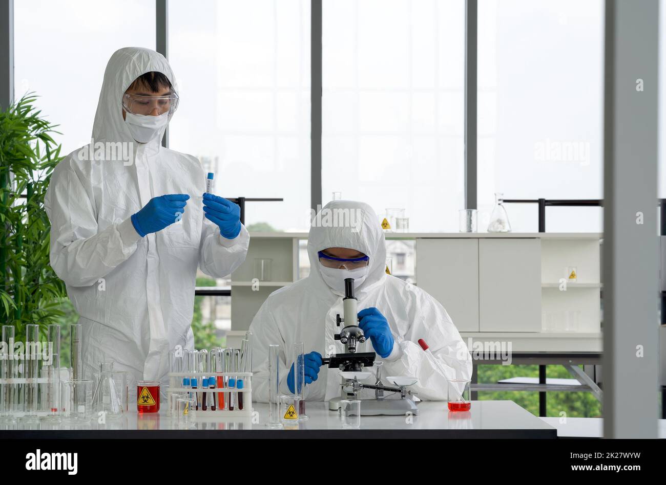 Medical researchers examining lab samples hi-res stock photography and ...