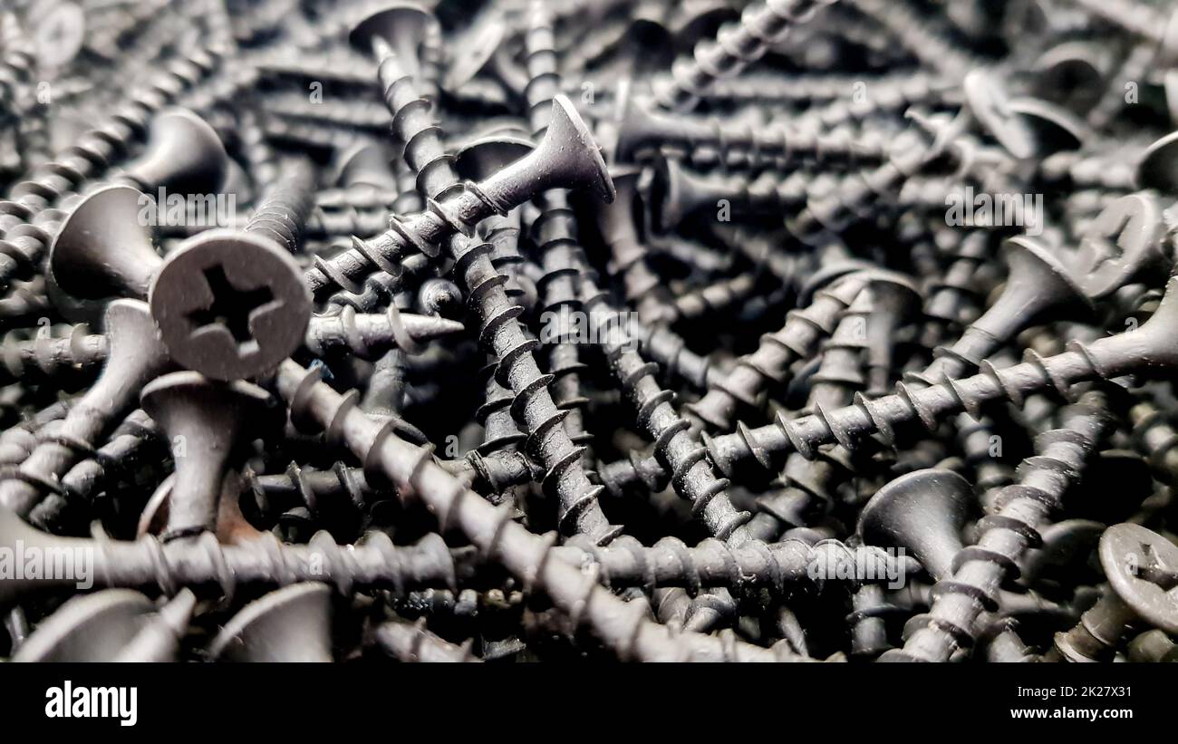 steel screws, metal screw, iron screw, screws as a background, wood ...