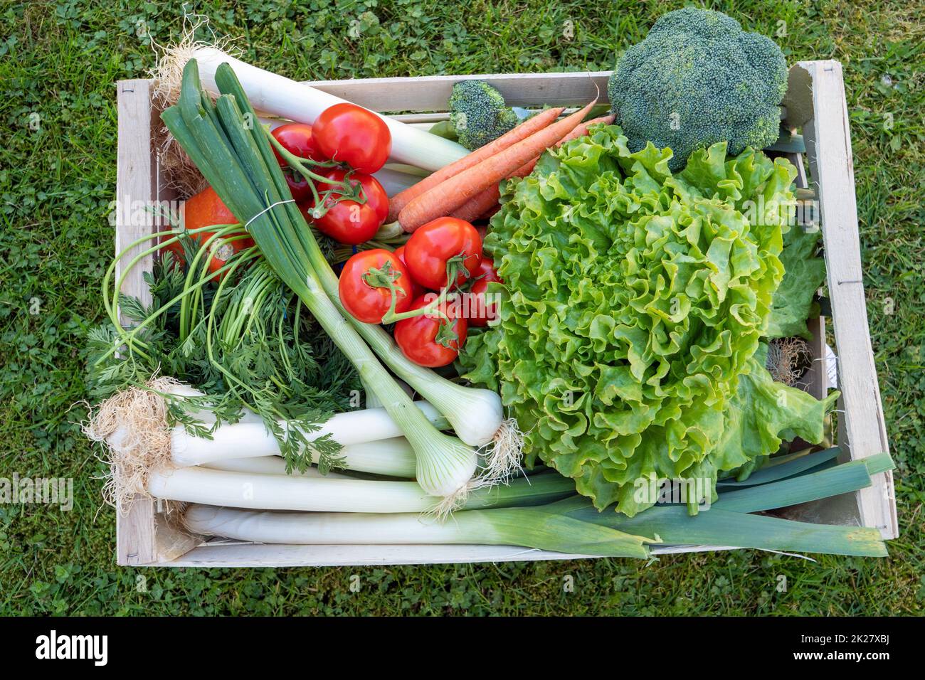 seasonal vegetables in wooden crate Stock Photo