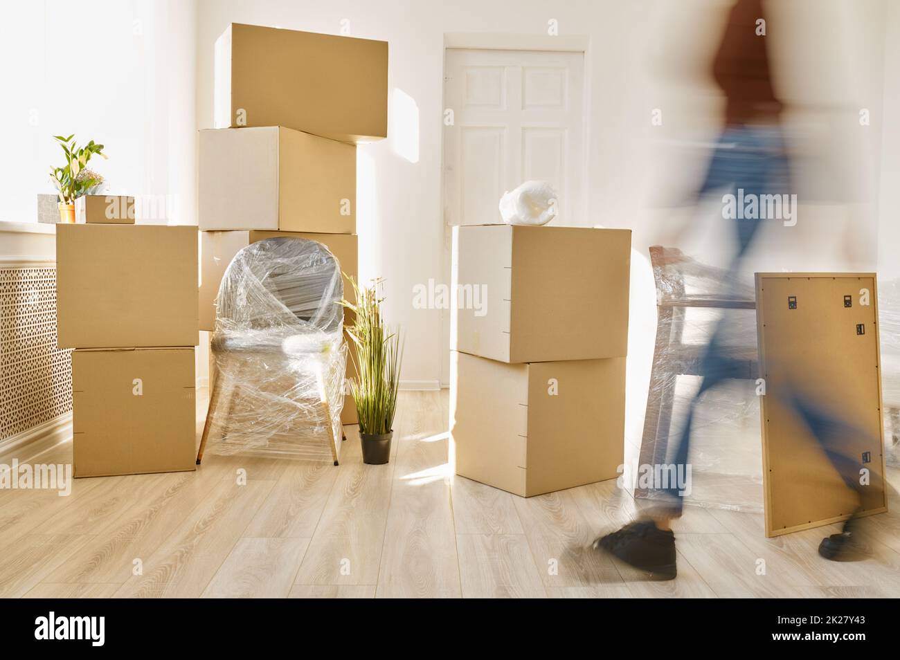 Person moving fast among plenty of boxes Stock Photo