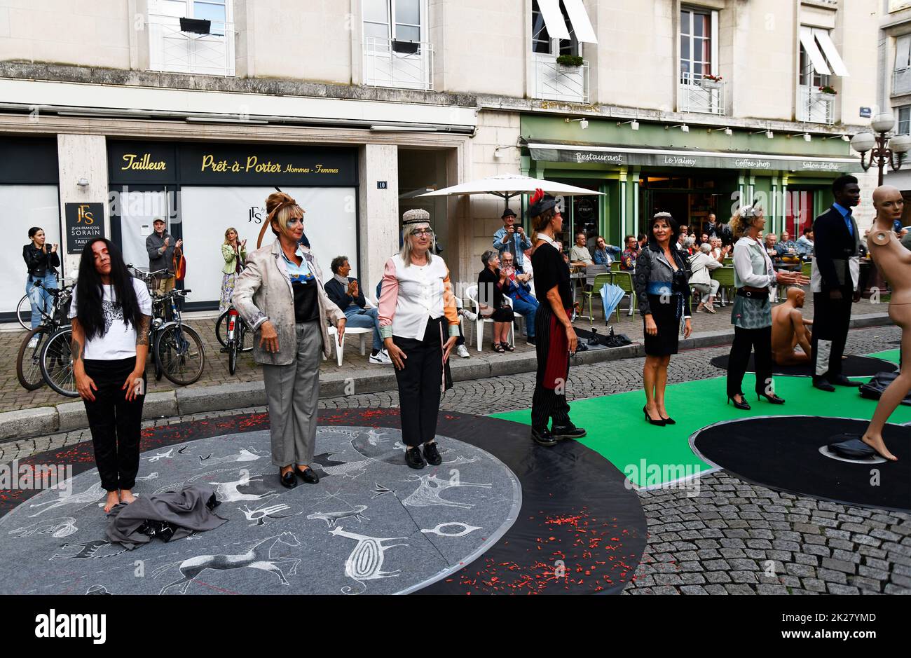 Avant-garde fashion parade show outside cafe restaurant inTours, France Stock Photo