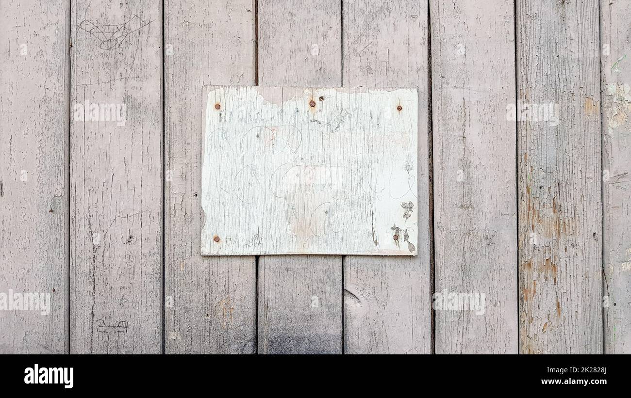 Sign boards on a rustic wooden wall mockup. vintage frames on an old wooden wall. Gray wooden background texture with copy space. wall wood table. Stock Photo