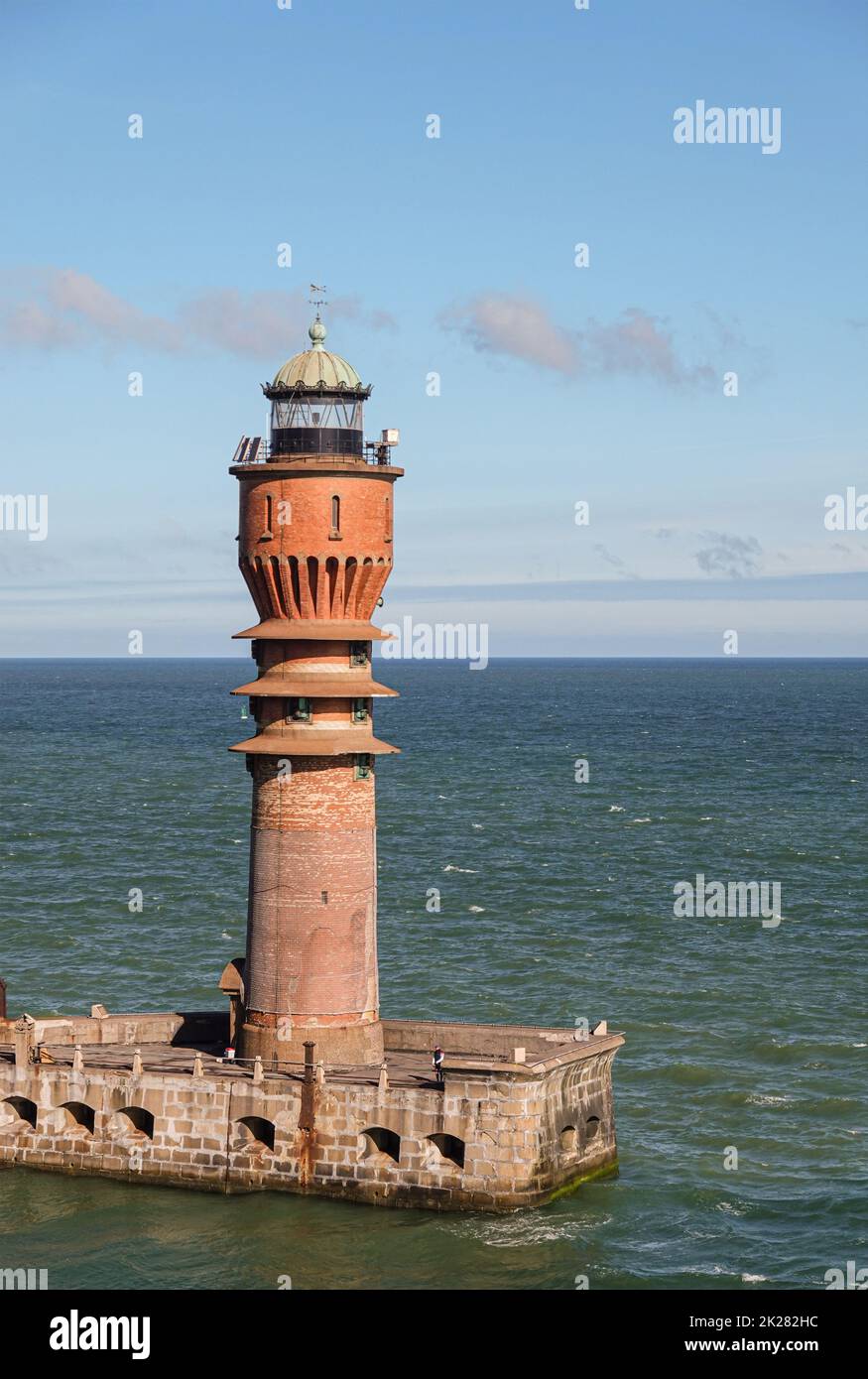 Europe, France, Dunkerque - July 9, 2022: Port scenery. Point of entrance marked by Feu de Saint Pol, light tower. North sea as backdrop under light b Stock Photo