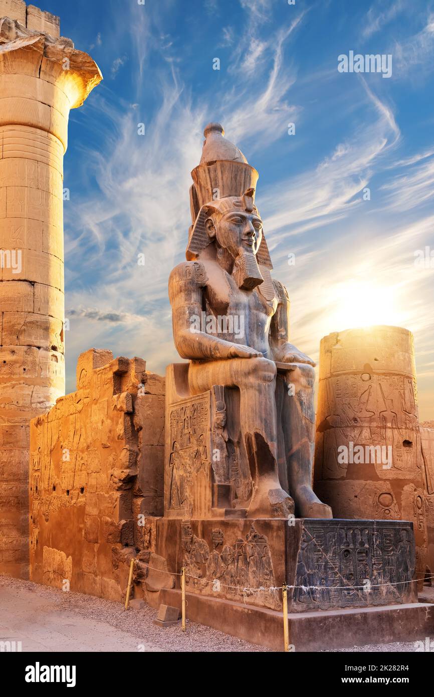 Seated statue of Ramesses II by the Luxor Temple entrance, Egypt Stock Photo