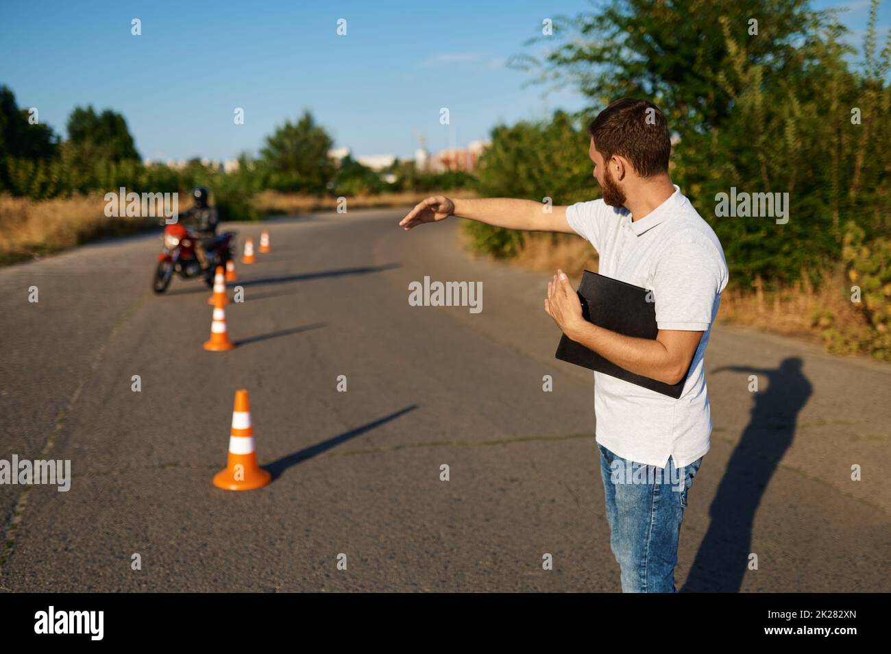 Student rides around the cones, motorcycle school Stock Photo