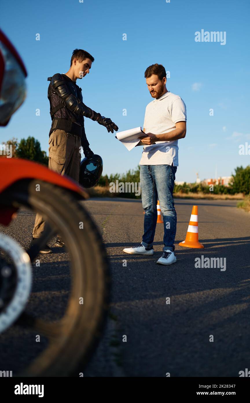 Male student and instructor, motorcycle school Stock Photo