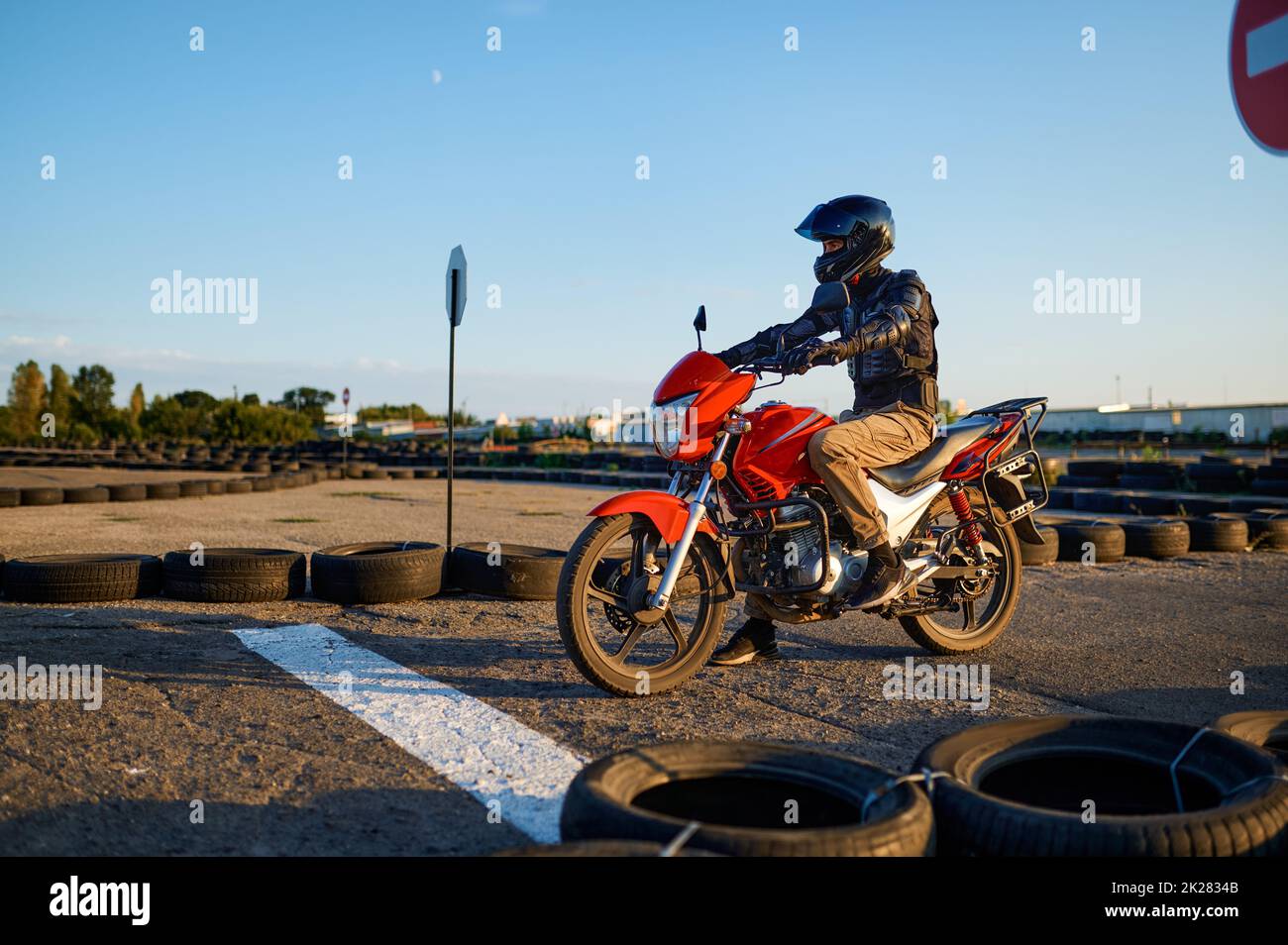 Student on motorbike at starting line, motordrome Stock Photo