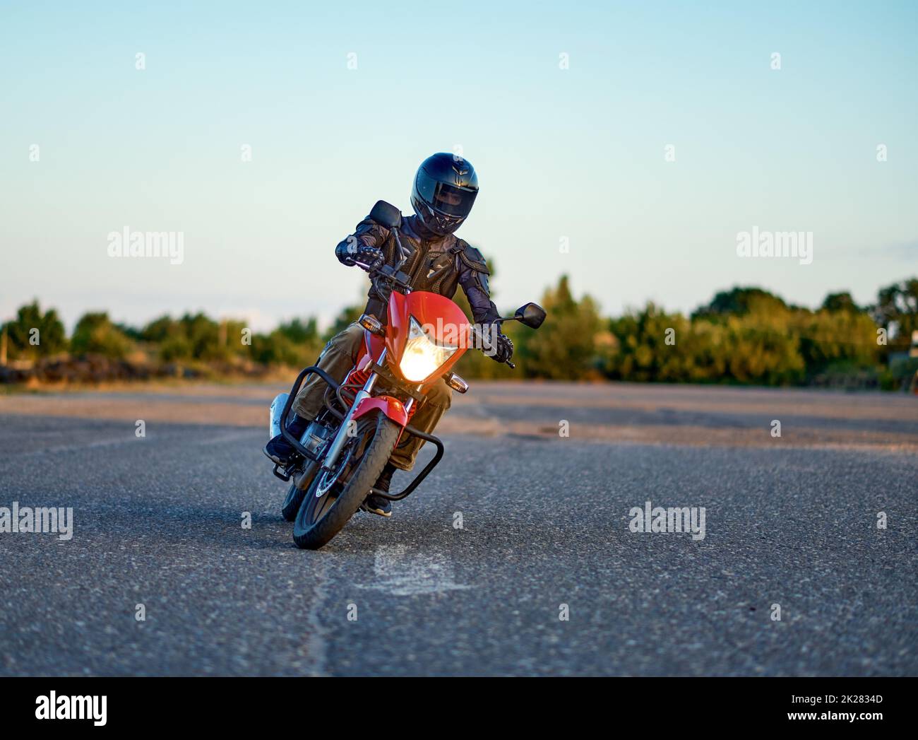Student riding on motordrome in motorcycle school Stock Photo