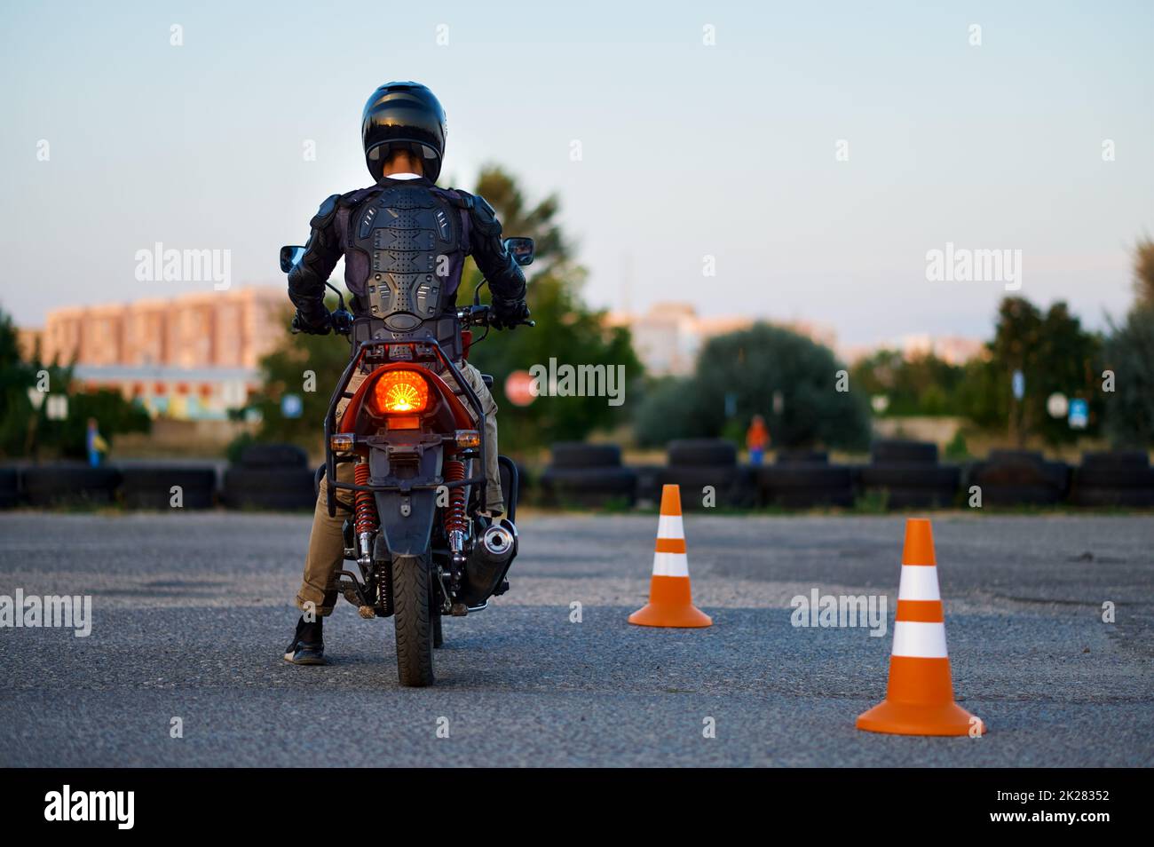 Student on motorbike, back view, motorcycle school Stock Photo