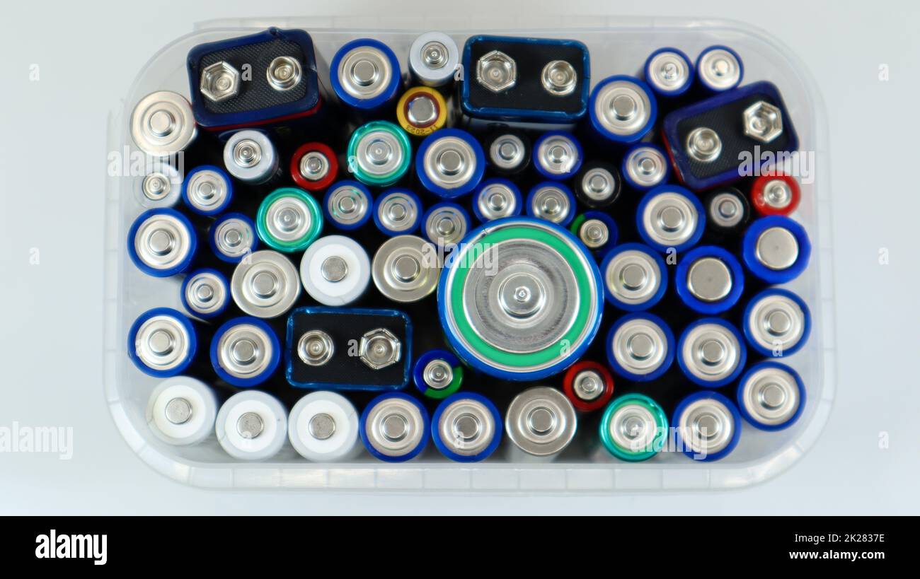 Clear plastic box full of used household AA alkaline and lithiumion