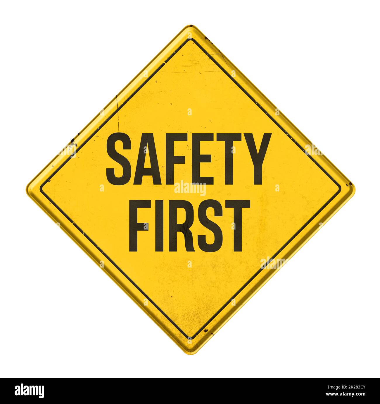 Yellow sign on a white background - Safety first Stock Photo