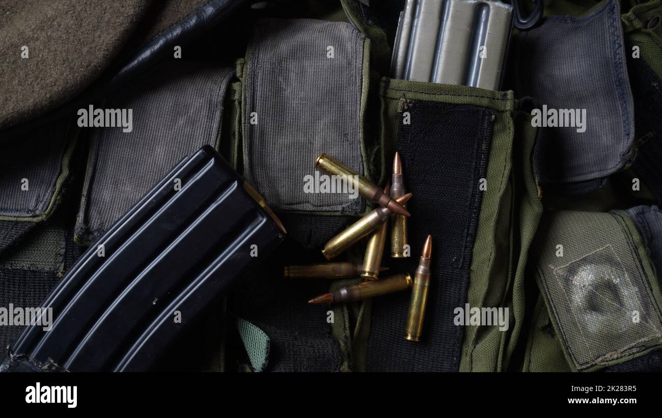 Photo of 5.56mm ammunition,  rifle ammunition in magazines, on armor vest Stock Photo