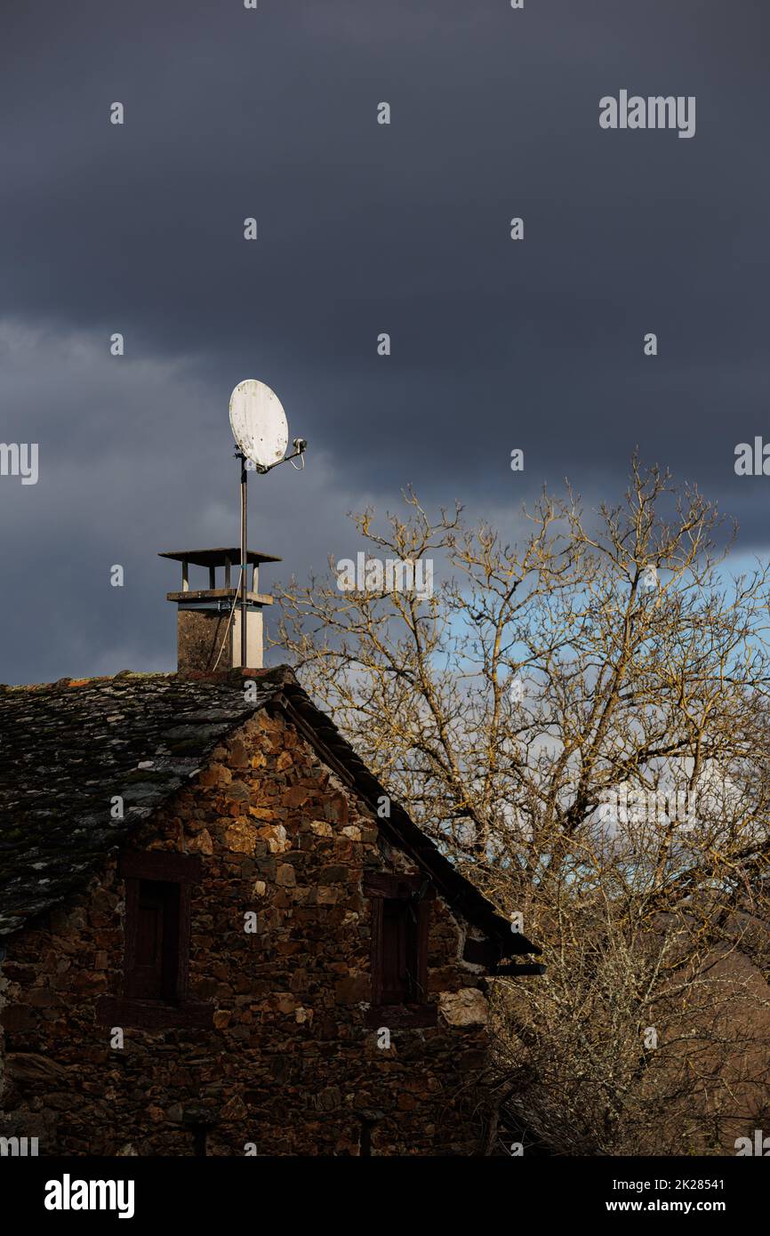 Old house with satelite antenna on the roof Stock Photo Alamy