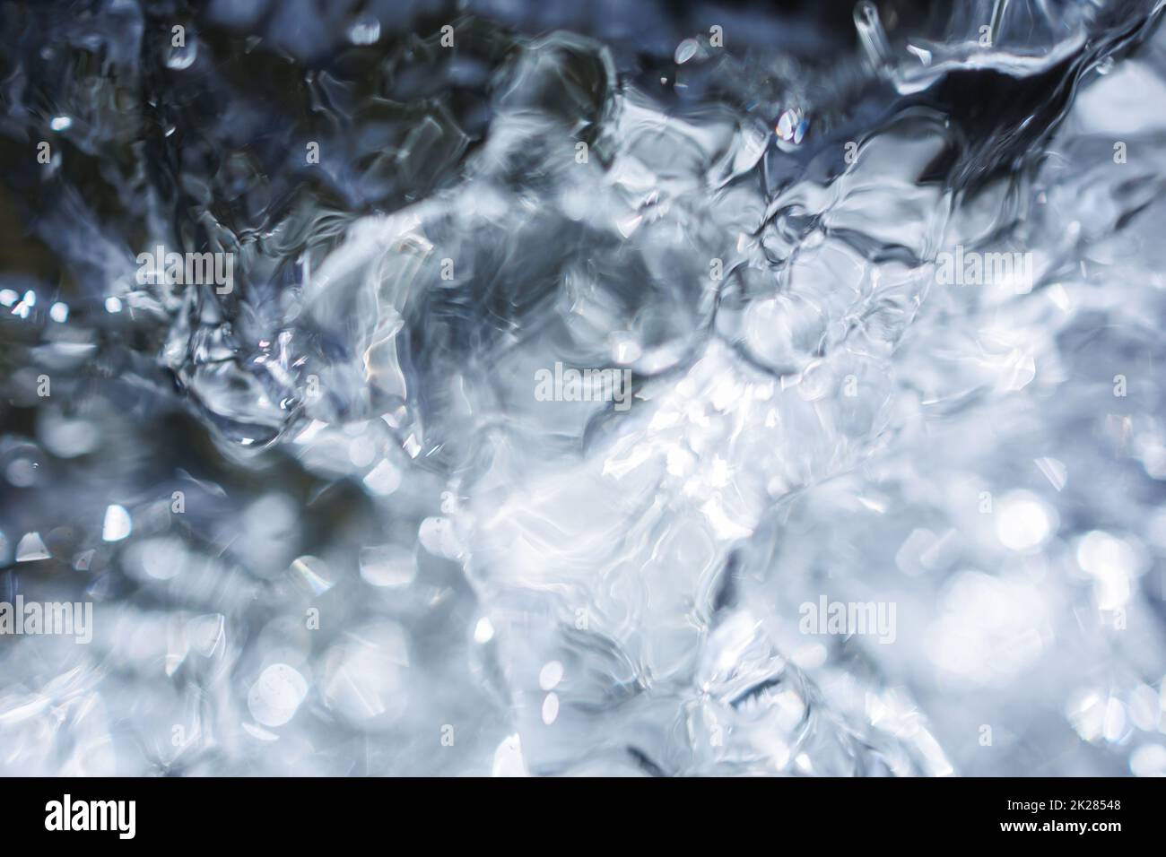 Flowing water with air bubbles Stock Photo