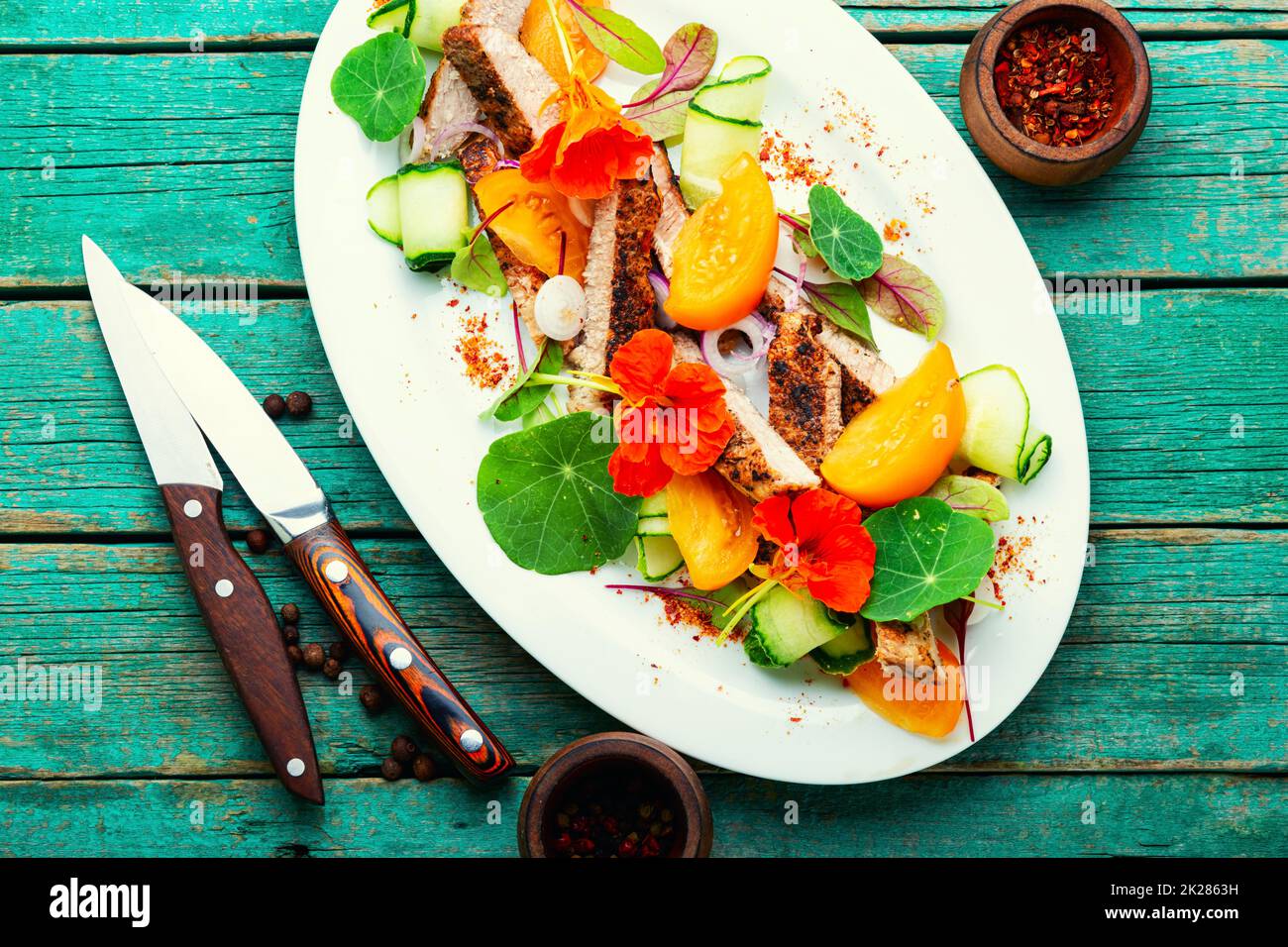 Sliced steak with vegetables, meat salad Stock Photo
