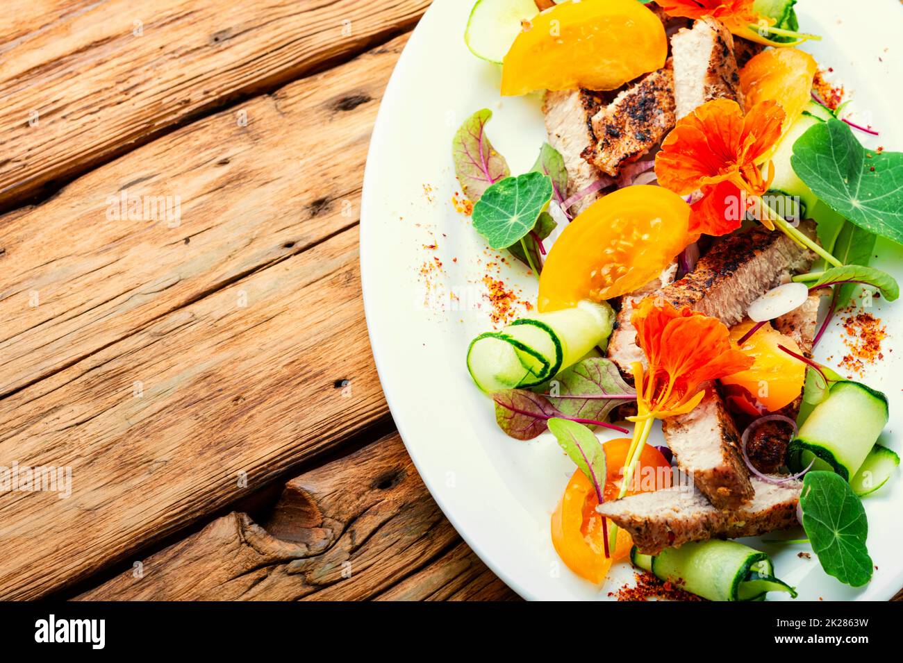 Bright salad with meat steak. Stock Photo