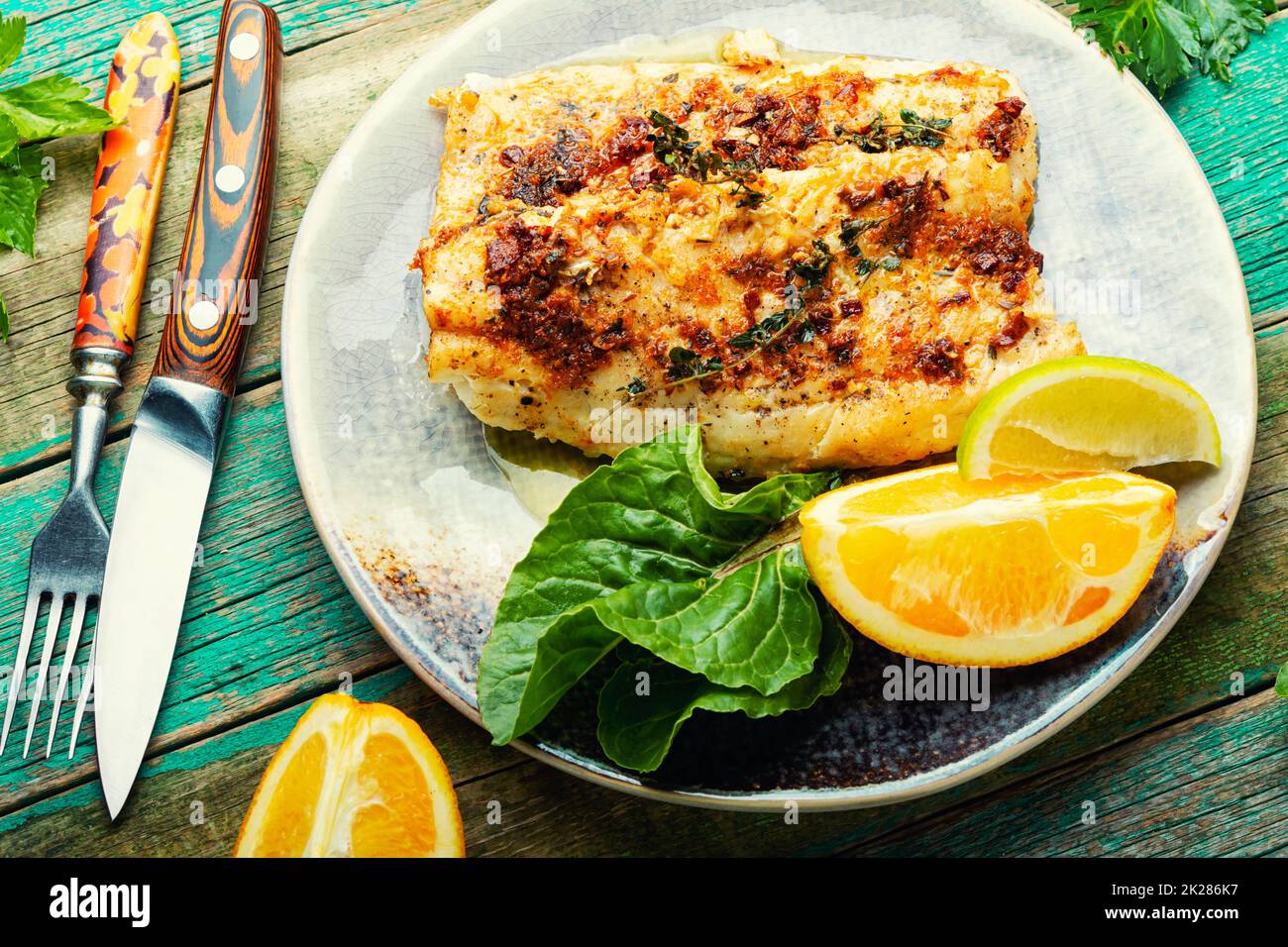 Fried fish fillets in orange oil Stock Photo Alamy