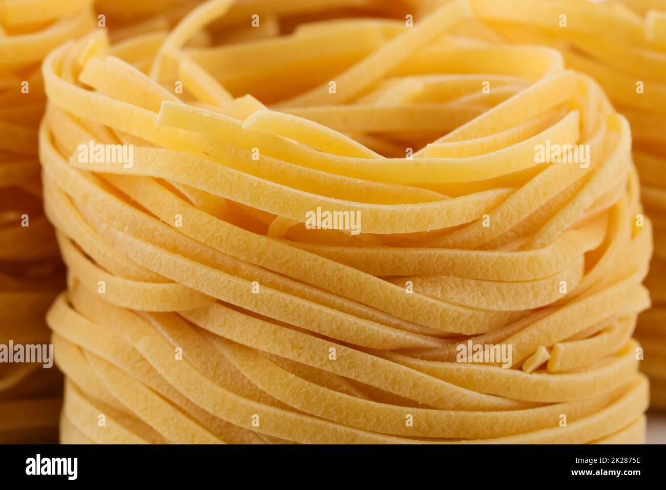 dried italian pasta, fettuccine nests Stock Photo