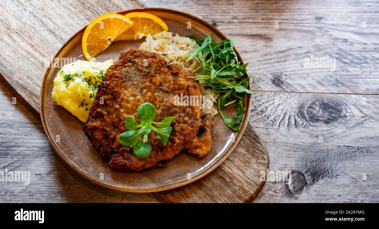 Pork breaded cutlet coated with breadcrumbs with mashed potatoes Stock