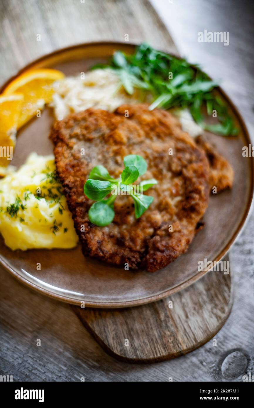 Pork breaded cutlet coated with breadcrumbs with mashed potatoes Stock