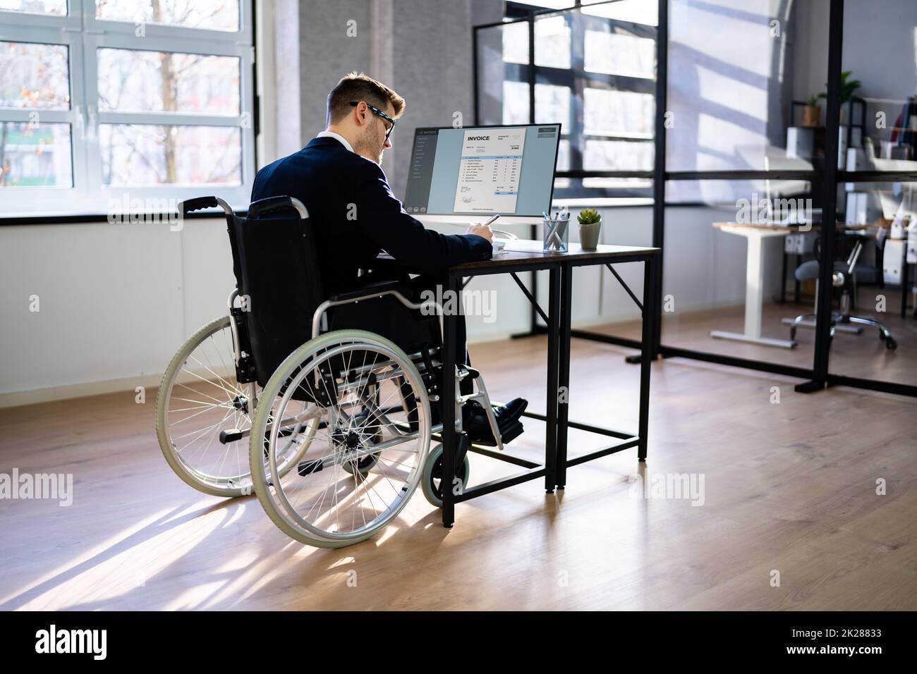 Accountant Using Tax Software In Office. Invoice Bill Stock Photo
