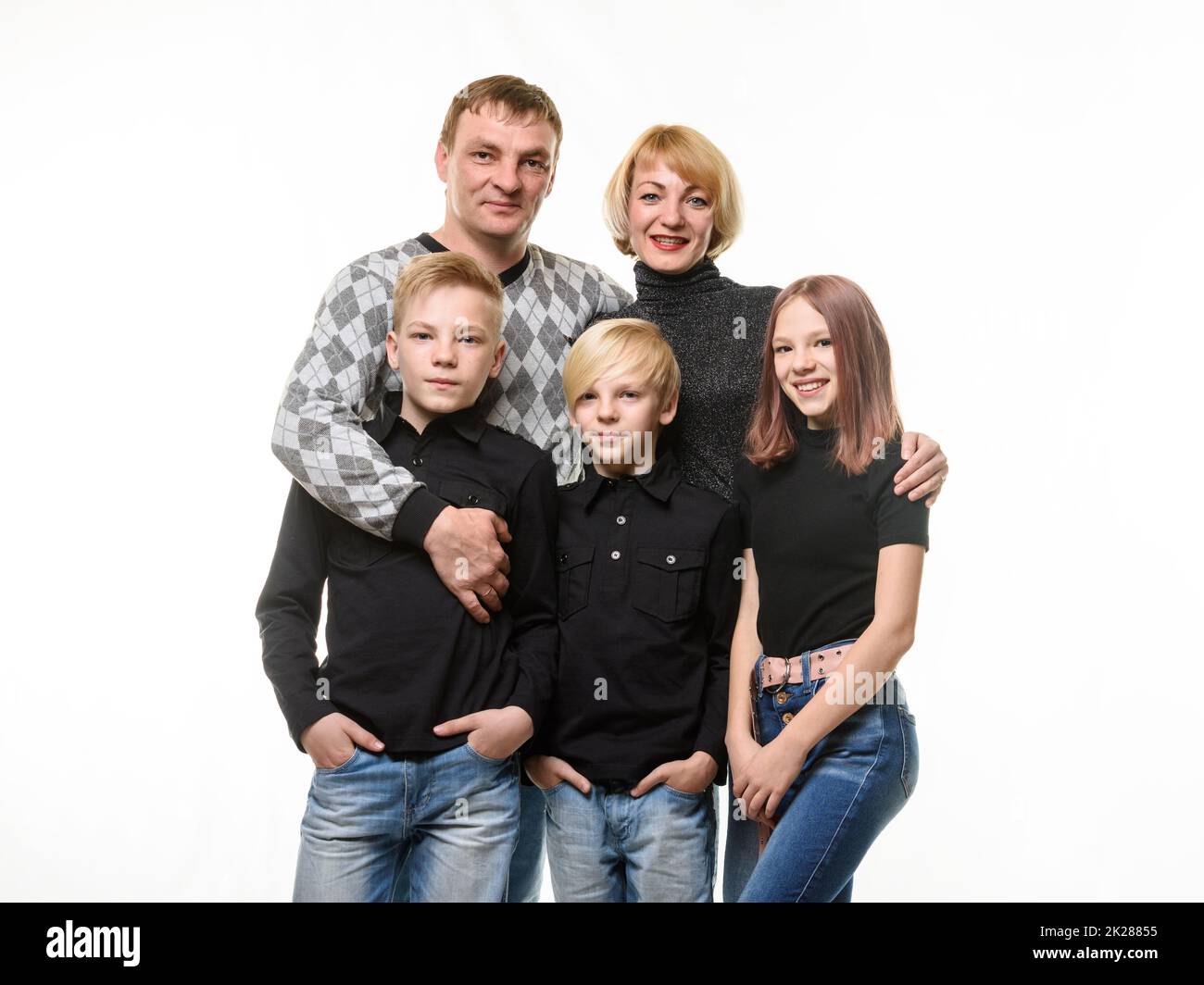 Happy adult large family of Slavic appearance in casual clothes, isolated on white background Stock Photo